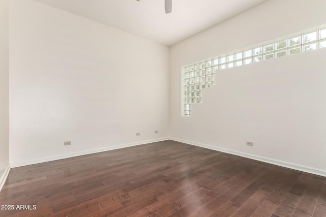 902 W Glendale Ave Unit 102, Phoenix, AZ 85021 - spare room featuring plenty of natural light, ceiling fan, dark wood finished floors, and baseboards