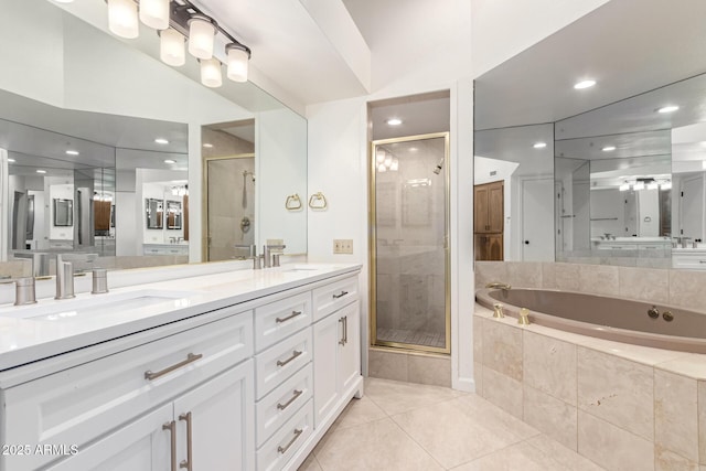 902 W Glendale Ave Unit 102, Phoenix, AZ 85021 - bathroom with double vanity, a shower stall, tile patterned floors, a garden tub, and recessed lighting