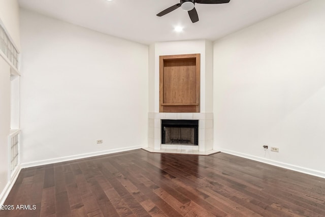 902 W Glendale Ave Unit 102, Phoenix, AZ 85021 - unfurnished living room with a tile fireplace, dark wood-type flooring, a ceiling fan, baseboards, and recessed lighting