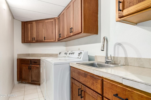 902 W Glendale Ave Unit 102, Phoenix, AZ 85021 - washroom featuring independent washer and dryer, cabinet space, and light tile patterned flooring