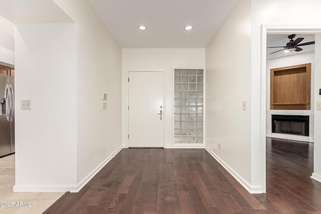902 W Glendale Ave Unit 102, Phoenix, AZ 85021 - entryway featuring a ceiling fan, wood finished floors, a fireplace, recessed lighting, and baseboards