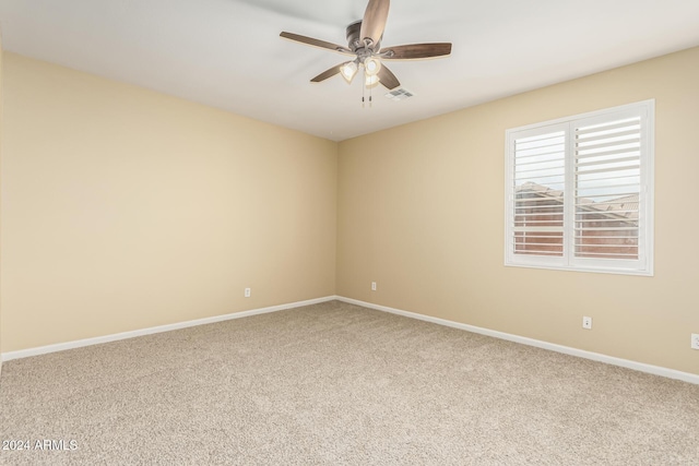 spare room featuring carpet flooring and ceiling fan