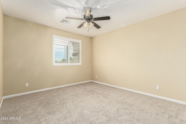 unfurnished room with ceiling fan and carpet floors