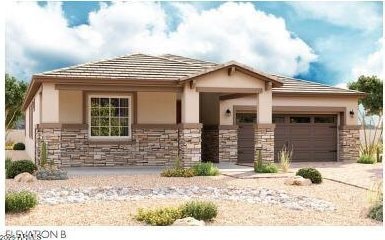 view of front of house with stone siding, an attached garage, driveway, and stucco siding