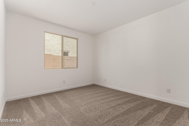 40563 W Michaels Dr, Maricopa, AZ 85138 - empty room featuring carpet floors and baseboards