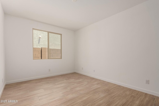 40563 W Michaels Dr, Maricopa, AZ 85138 - empty room featuring light wood-style floors and baseboards