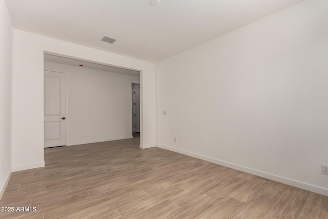 40563 W Michaels Dr, Maricopa, AZ 85138 - unfurnished room with light wood finished floors and baseboards