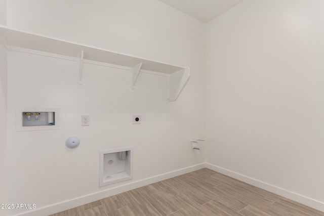 40563 W Michaels Dr, Maricopa, AZ 85138 - washroom featuring hookup for a washing machine, gas dryer hookup, baseboards, and electric dryer hookup