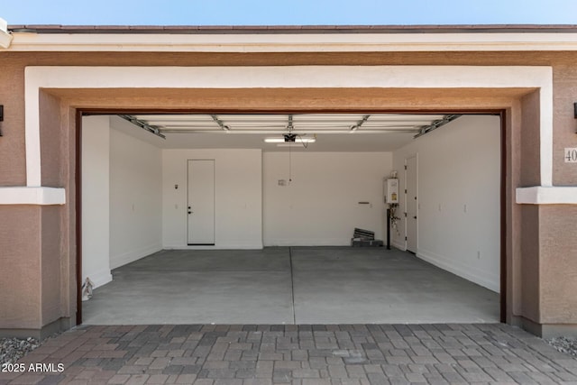 40563 W Michaels Dr, Maricopa, AZ 85138 - garage featuring tankless water heater and a garage door opener