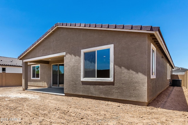 40563 W Michaels Dr, Maricopa, AZ 85138 - back of property featuring a patio, stucco siding, and central AC unit