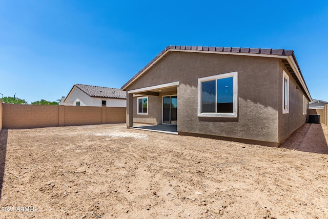 40563 W Michaels Dr, Maricopa, AZ 85138 - back of property featuring stucco siding, a fenced backyard, and a patio area