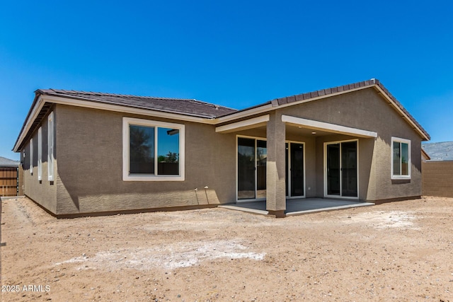 40563 W Michaels Dr, Maricopa, AZ 85138 - rear view of property featuring stucco siding and a patio area