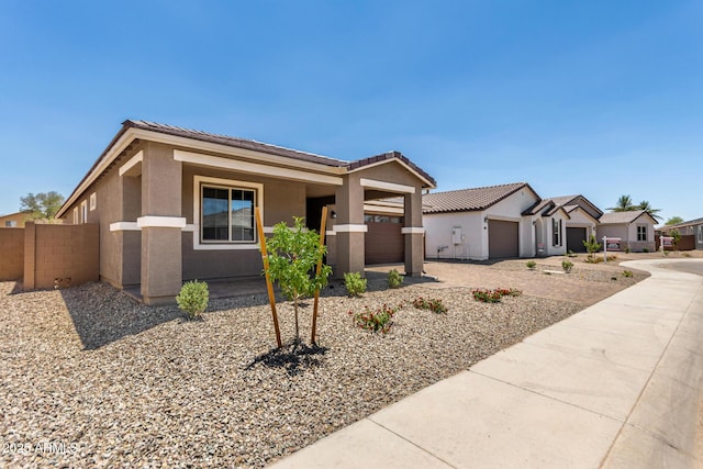 40563 W Michaels Dr, Maricopa, AZ 85138 - ranch-style house with a garage, stucco siding, concrete driveway, and a tiled roof