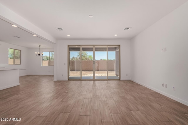 40563 W Michaels Dr, Maricopa, AZ 85138 - unfurnished room featuring a chandelier, light wood-style flooring, baseboards, and recessed lighting
