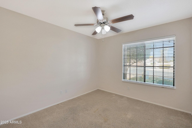 empty room with ceiling fan and carpet flooring