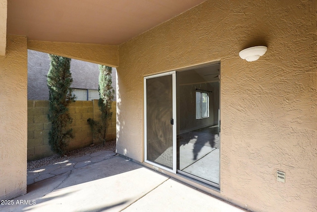 doorway to property with a patio