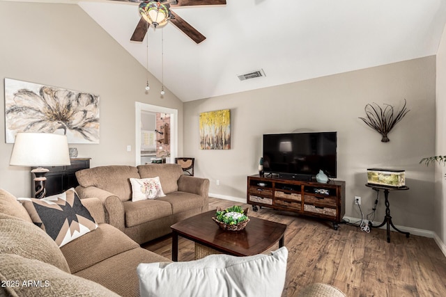 living room featuring ceiling fan, baseboards, wood finished floors, and high vaulted ceiling