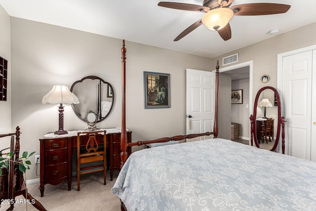 carpeted bedroom featuring baseboards and ceiling fan