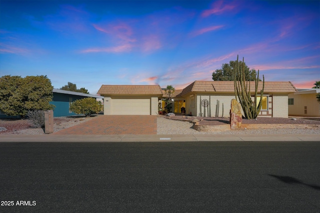 ranch-style home featuring a garage