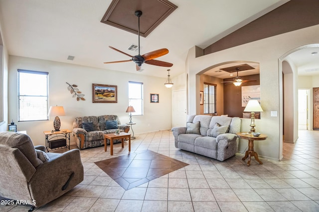 living room featuring light tile patterned floors and ceiling fan