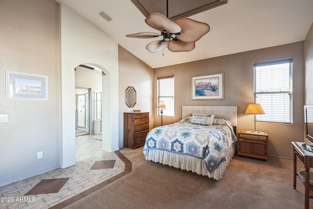 carpeted bedroom featuring multiple windows, ceiling fan, and lofted ceiling