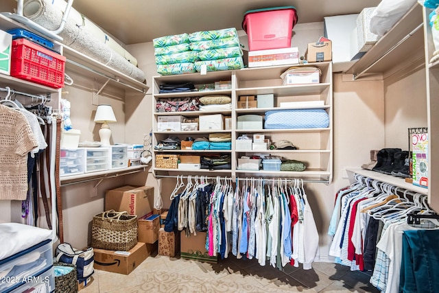 spacious closet with tile patterned floors