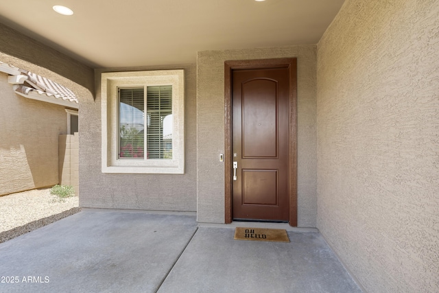 6338 W Raymond St, Phoenix, AZ 85043 - doorway to property with stucco siding