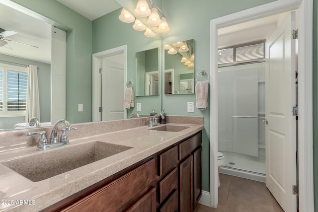 bathroom featuring a wealth of natural light, tile patterned flooring, a shower with shower door, and ceiling fan