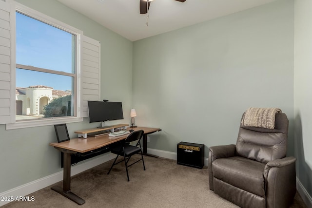 carpeted office space with ceiling fan