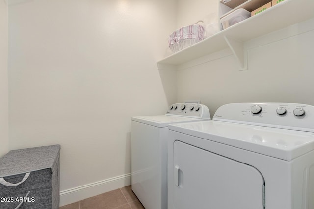 laundry room with light tile patterned flooring and independent washer and dryer