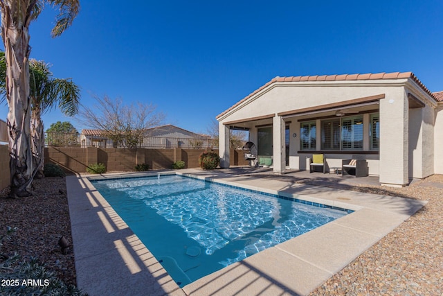 view of pool featuring a patio area and ceiling fan