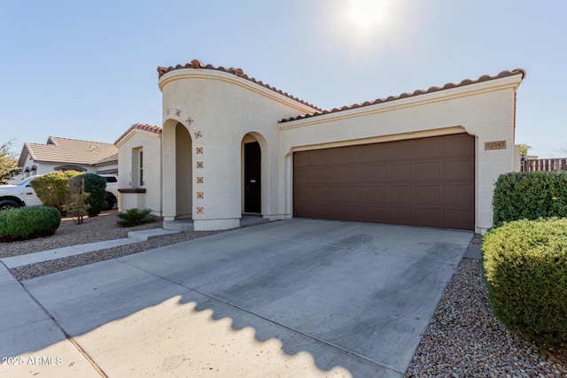 mediterranean / spanish-style house featuring a garage