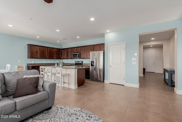 living room with sink and light tile patterned floors