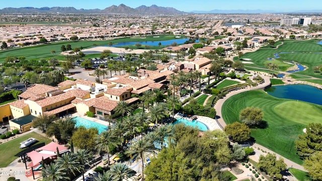 aerial view with a residential view, golf course view, and a water and mountain view