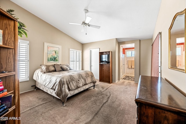 15194 W Vale Dr, Goodyear, AZ 85395 - bedroom featuring carpet floors, lofted ceiling, connected bathroom, and a ceiling fan