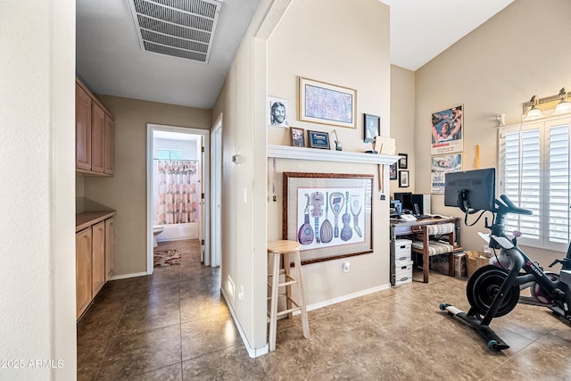 15194 W Vale Dr, Goodyear, AZ 85395 - workout room featuring tile patterned floors and baseboards