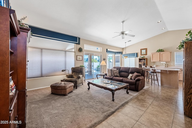 15194 W Vale Dr, Goodyear, AZ 85395 - living area featuring ceiling fan, vaulted ceiling, and light tile patterned floors