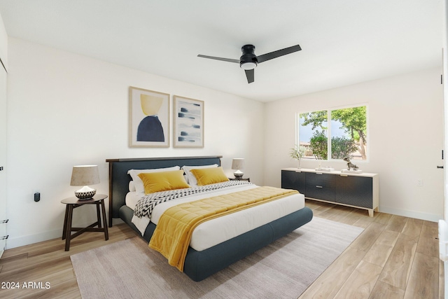 bedroom featuring hardwood / wood-style floors and ceiling fan