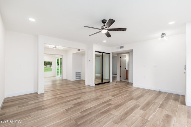 unfurnished bedroom with ceiling fan and light wood-type flooring