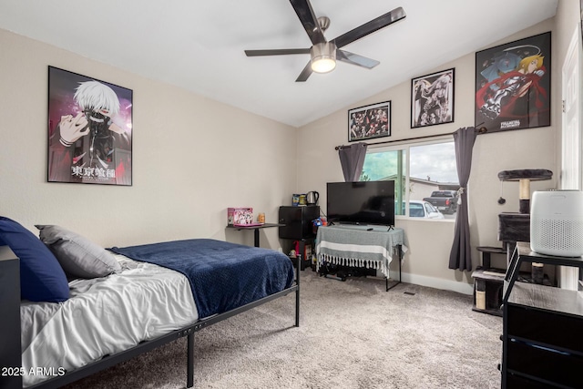 carpeted bedroom with lofted ceiling, a ceiling fan, and baseboards