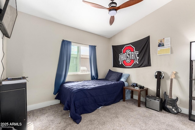 bedroom featuring baseboards, carpet floors, lofted ceiling, and a ceiling fan