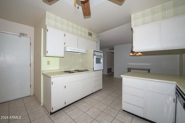 washroom featuring cabinets and washing machine and clothes dryer