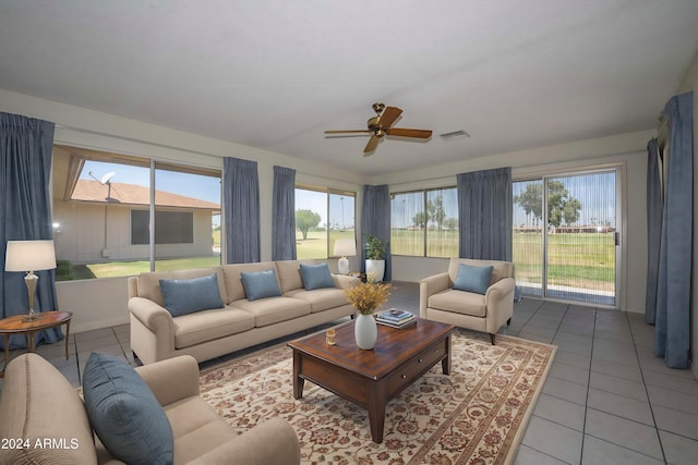 unfurnished room featuring light carpet, a textured ceiling, visible vents, and a ceiling fan