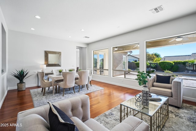 living room featuring dark hardwood / wood-style flooring and plenty of natural light