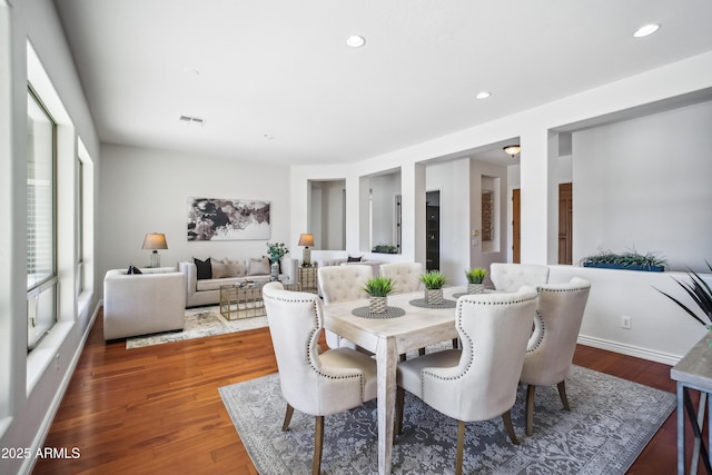 dining space featuring hardwood / wood-style flooring