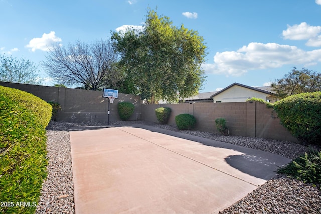 view of patio / terrace featuring basketball hoop