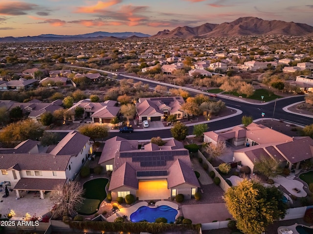 aerial view at dusk with a mountain view