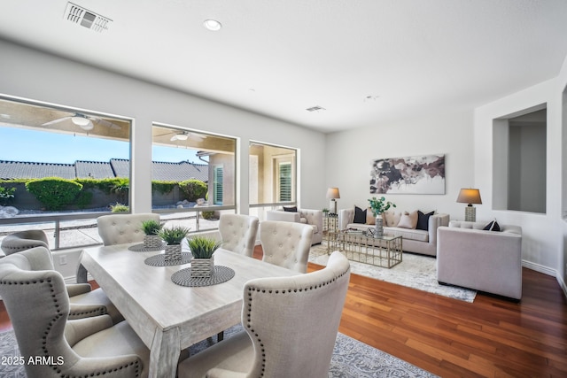 dining space with dark hardwood / wood-style floors