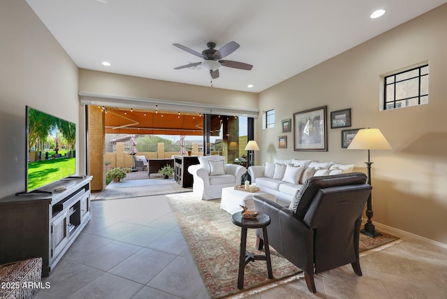 tiled living room featuring ceiling fan