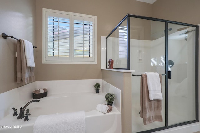 bathroom with separate shower and tub